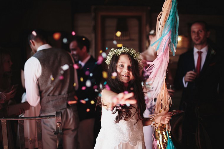 Flower girl throwing confetti