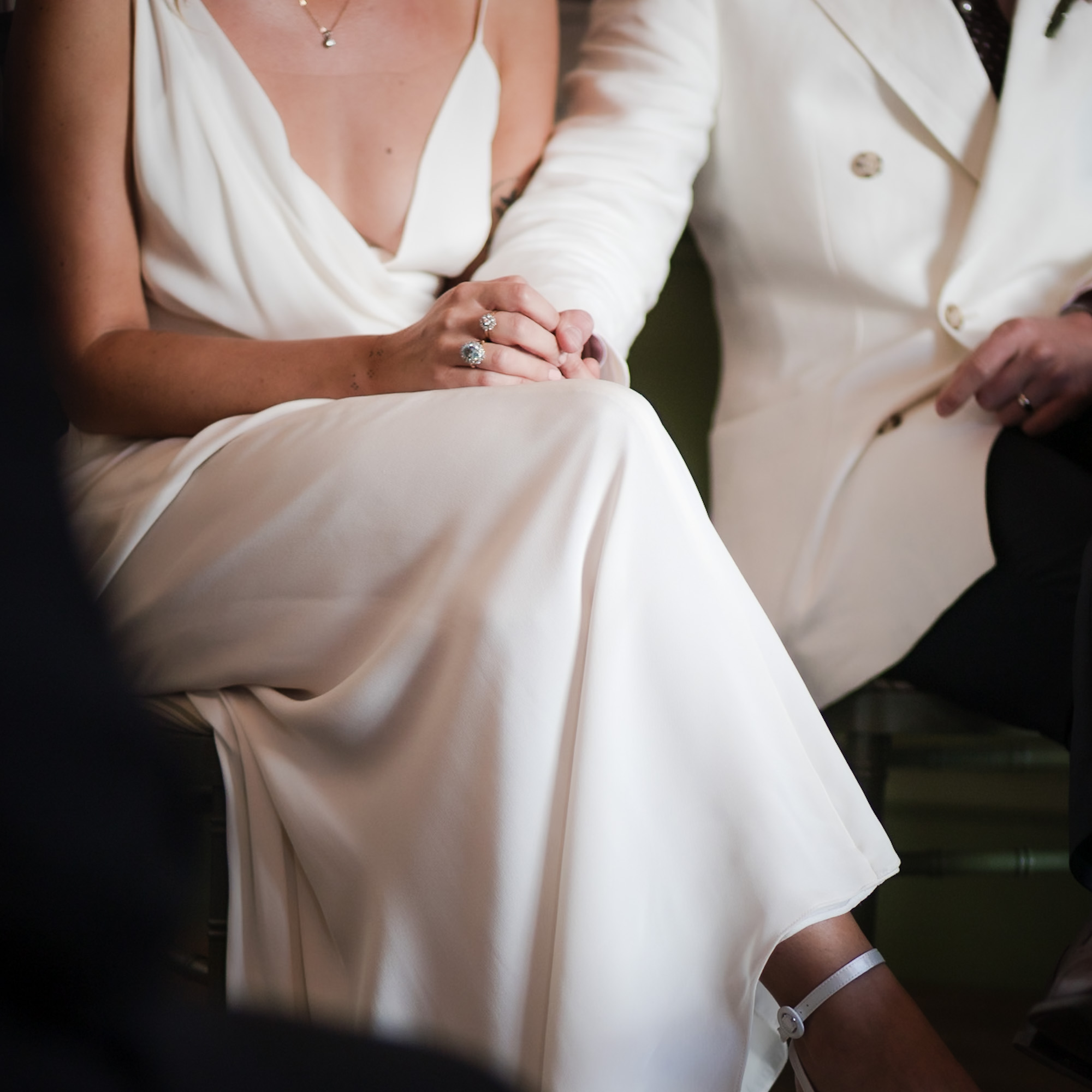 Bride and groom holding hands during the wedding ceremony